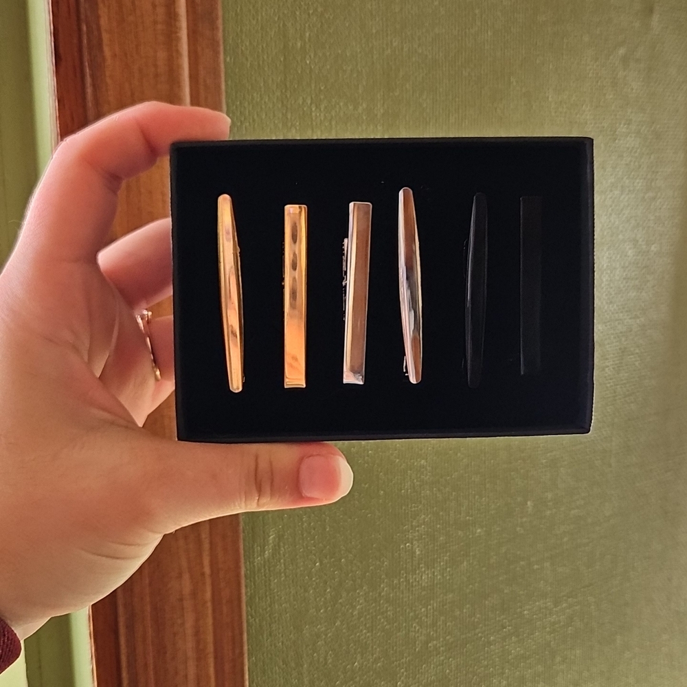 Set of Gold, Silver, and Black Tie Clips